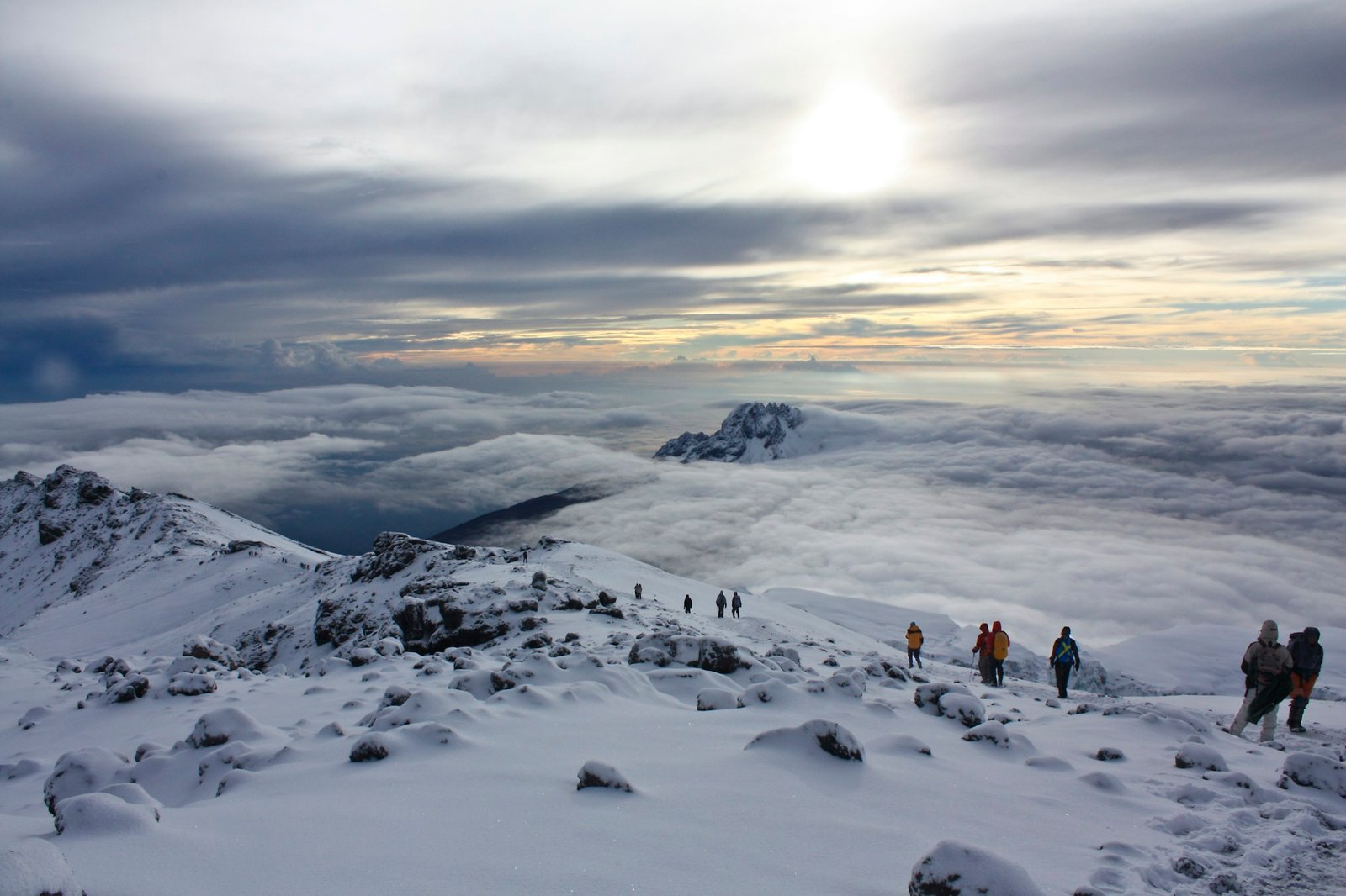 Climbers on Kilimanjaro at sunrise.